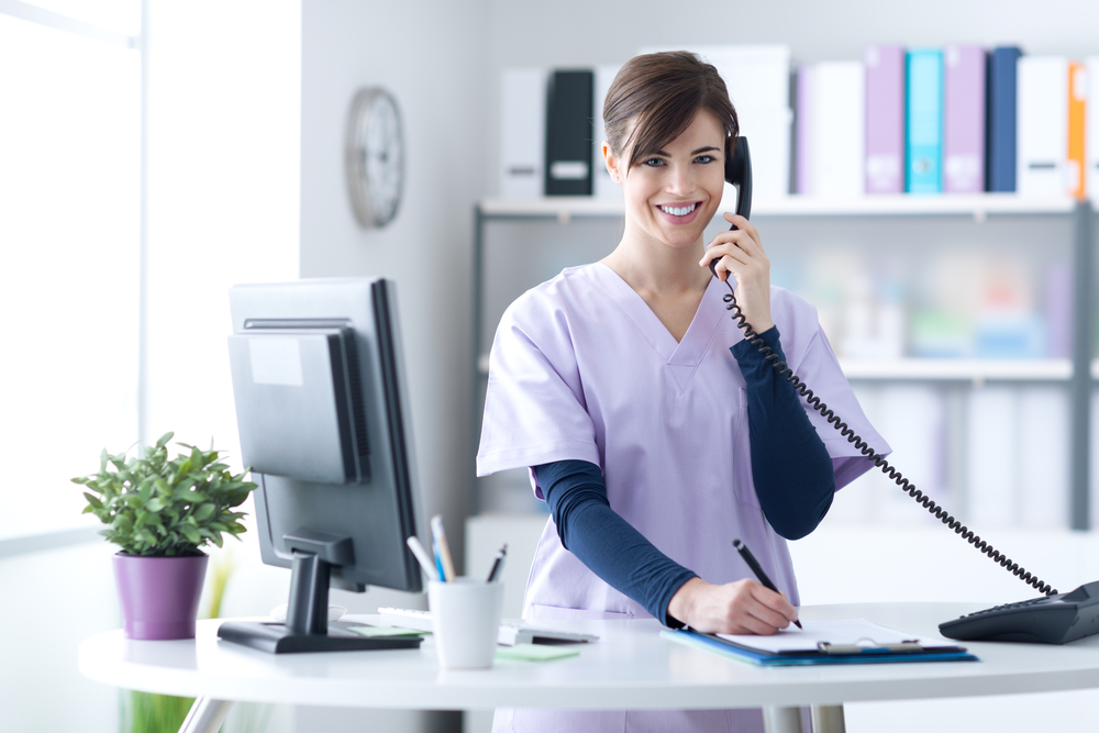 Young,Practitioner,Doctor,Working,At,The,Clinic,Reception,Desk,,She Dr Gayetri & Associates functional medicine, a holistic and science-based approach to health